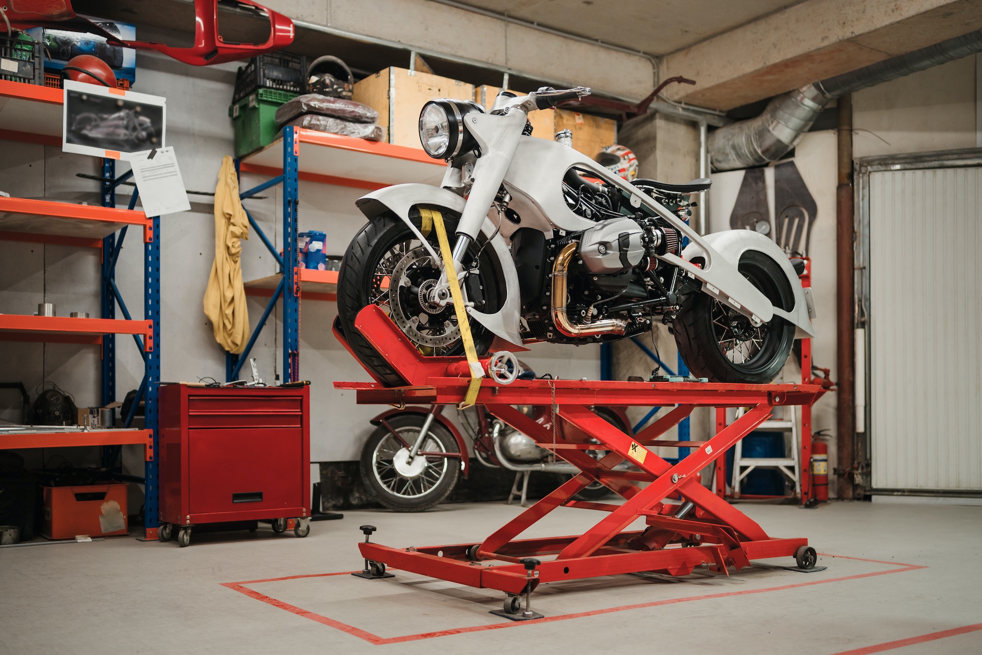 Custom motorcycle standing in repair shop