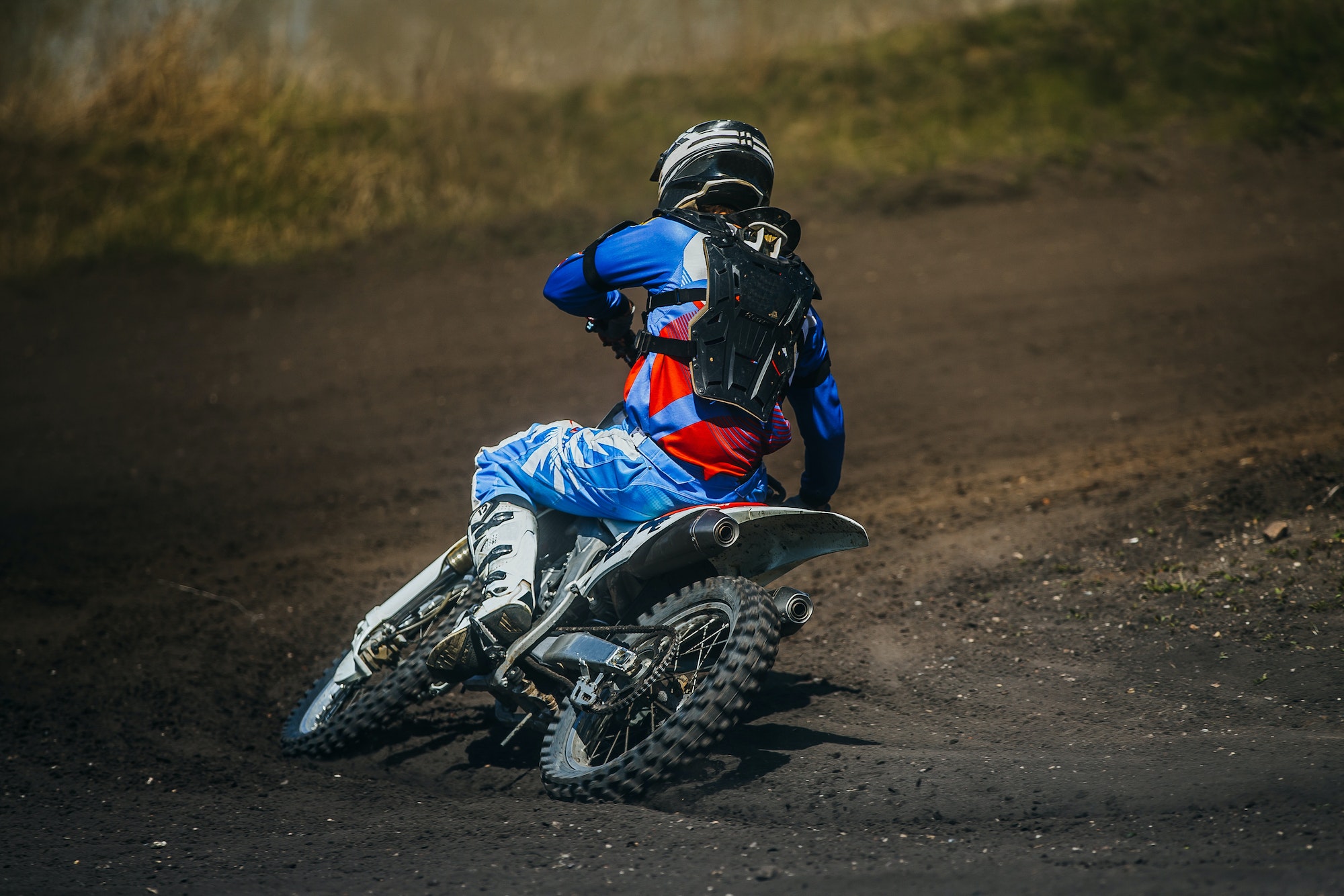 Motorcycle racer on motorcycle rides